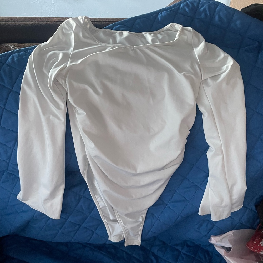 white body suit with flared sleeves